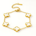 Gold bracelet with clover-shaped links on a white background