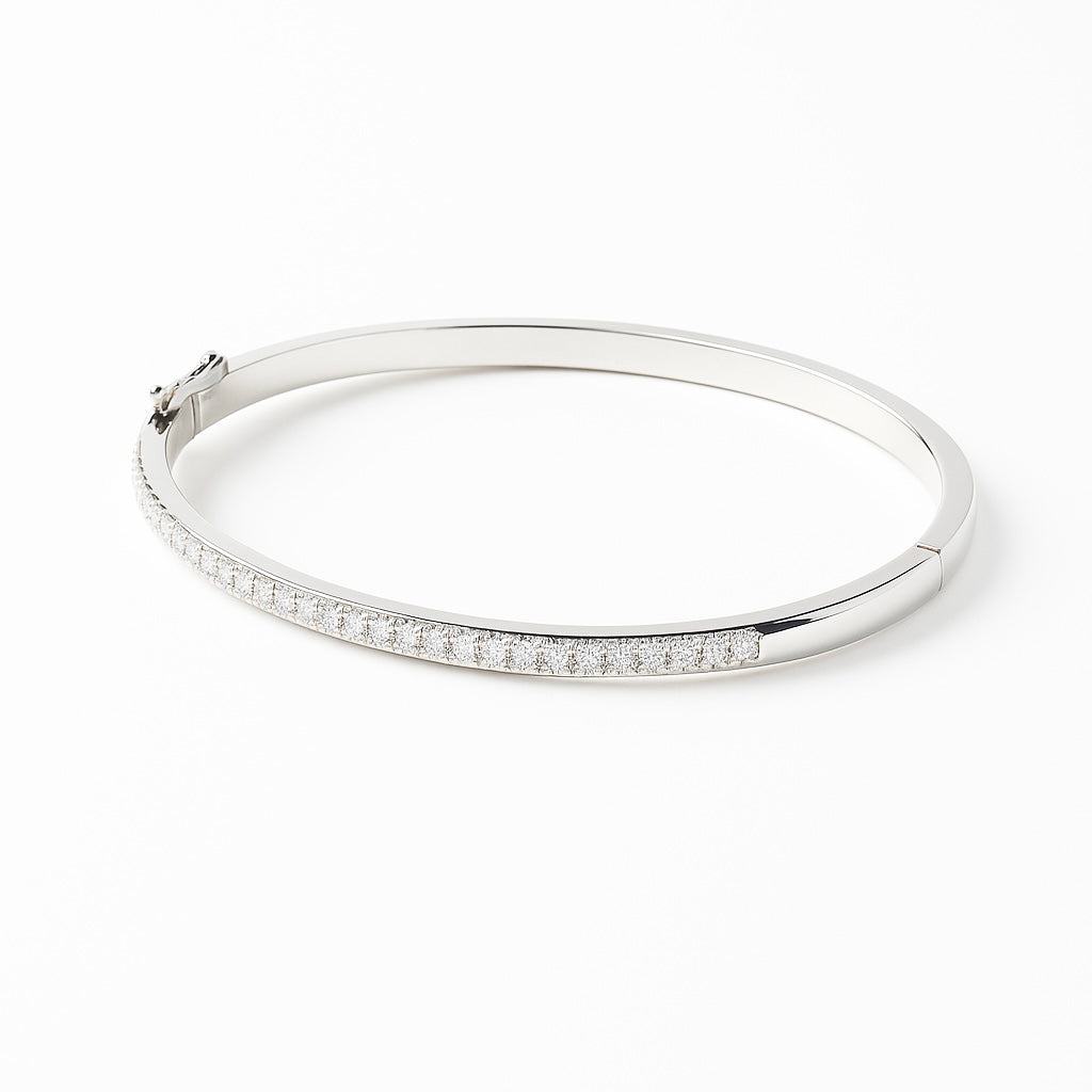 Silver bracelet with small diamonds on a white background